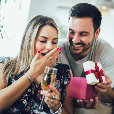 man giving woman anniversary gift